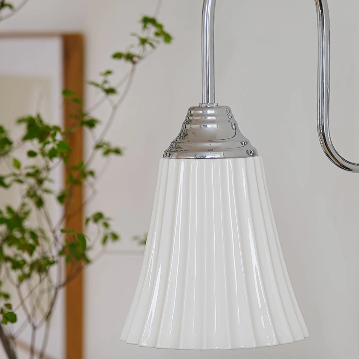 Brushed nickel wall sconce detailed frontal close-up - ceramic pleated shade architectural lighting
