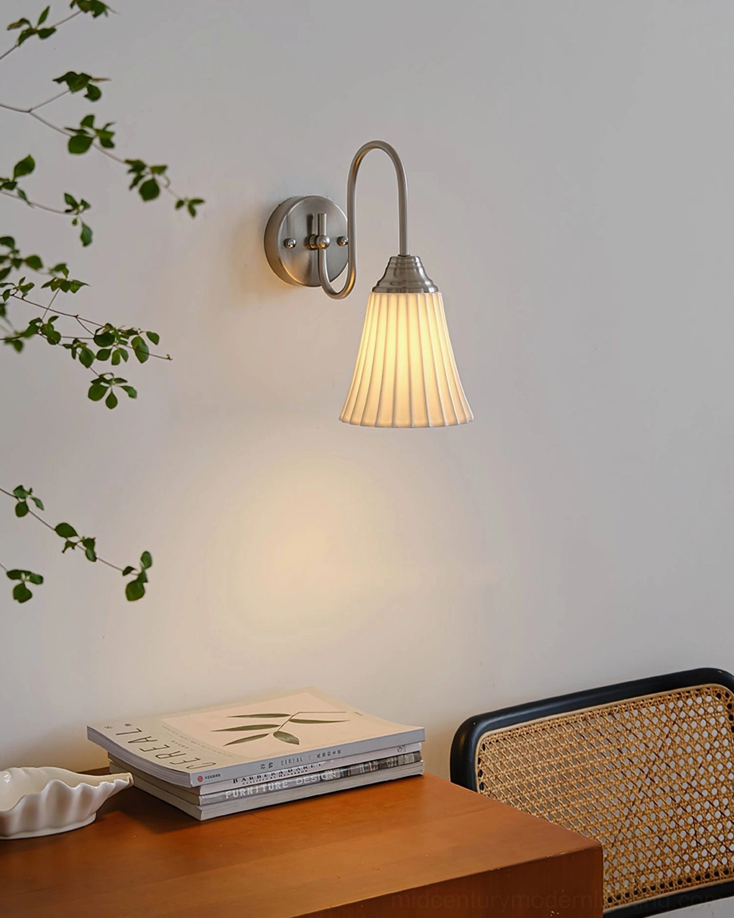 Lit brass gold wall sconce glowing warm yellow light - ambient bedroom lighting effect