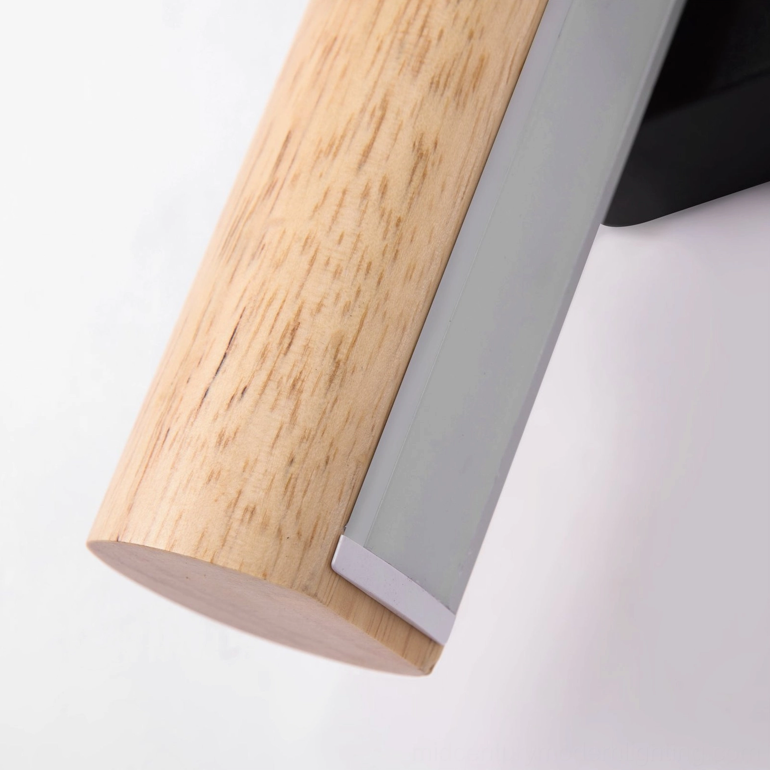 Close-up detail of rotatable tube lamp showing natural wood grain texture and metal frame construction