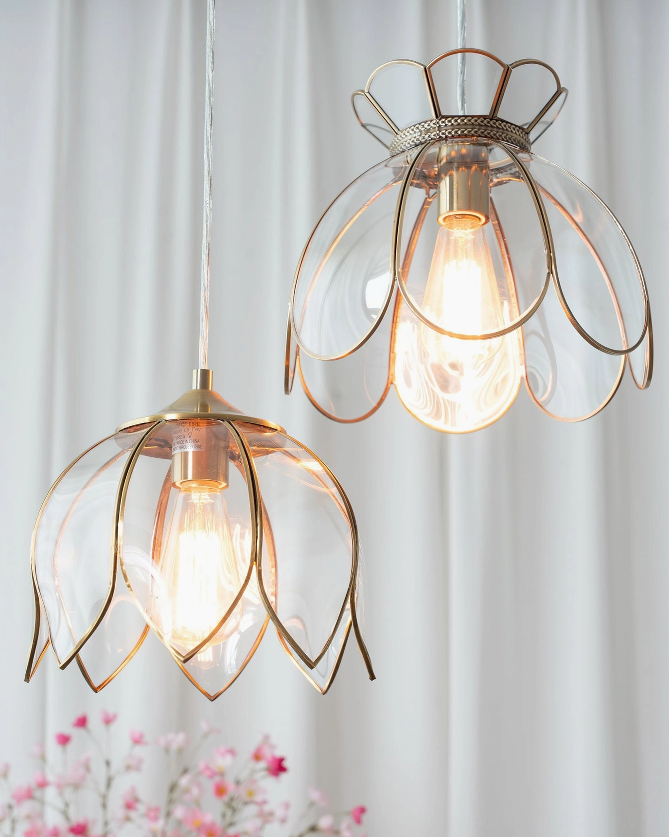 Turrella botanical petal pendant light with clear glass and brass hardware detail view