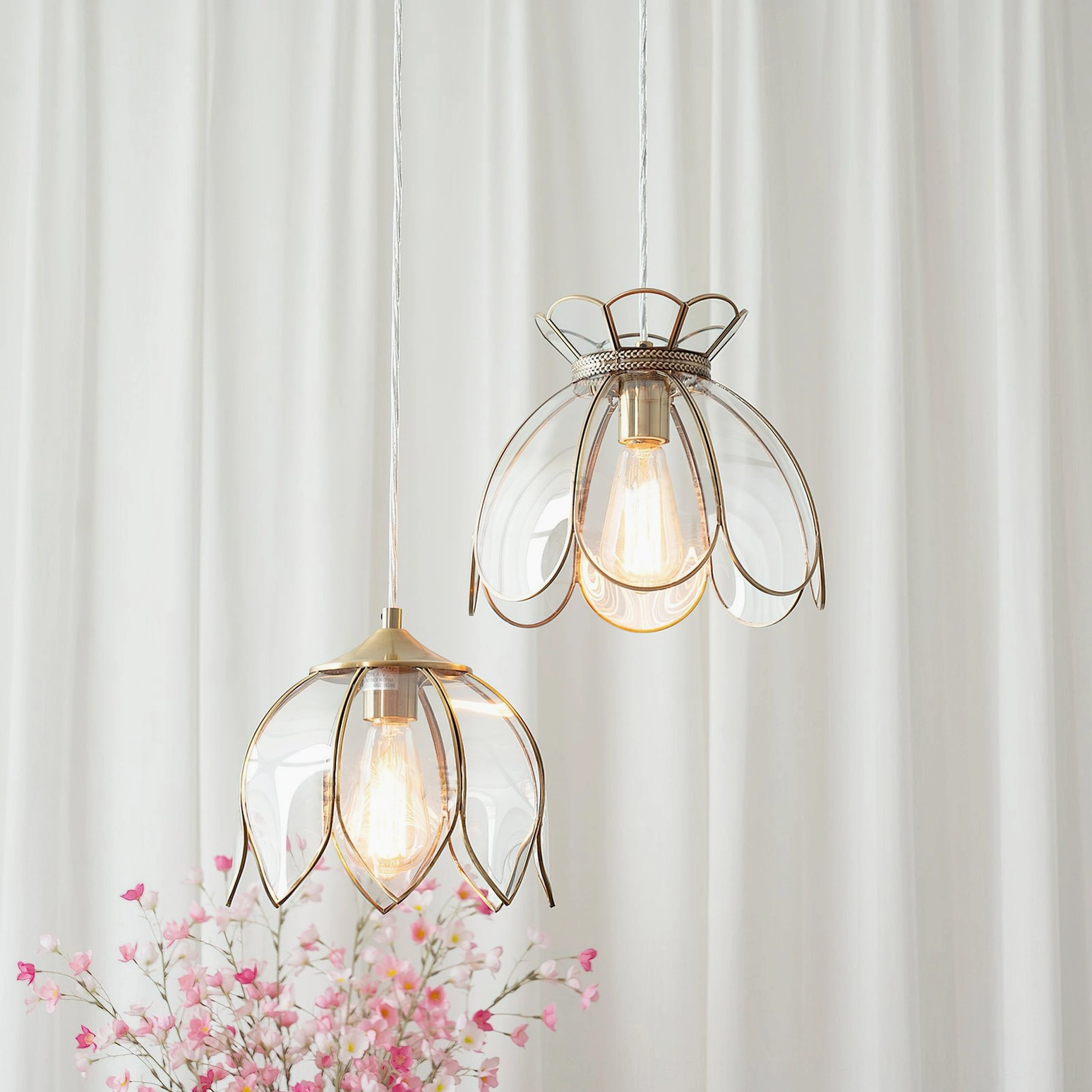 Turrella mid-century modern pendant light with blue tinted glass and warm brass accents