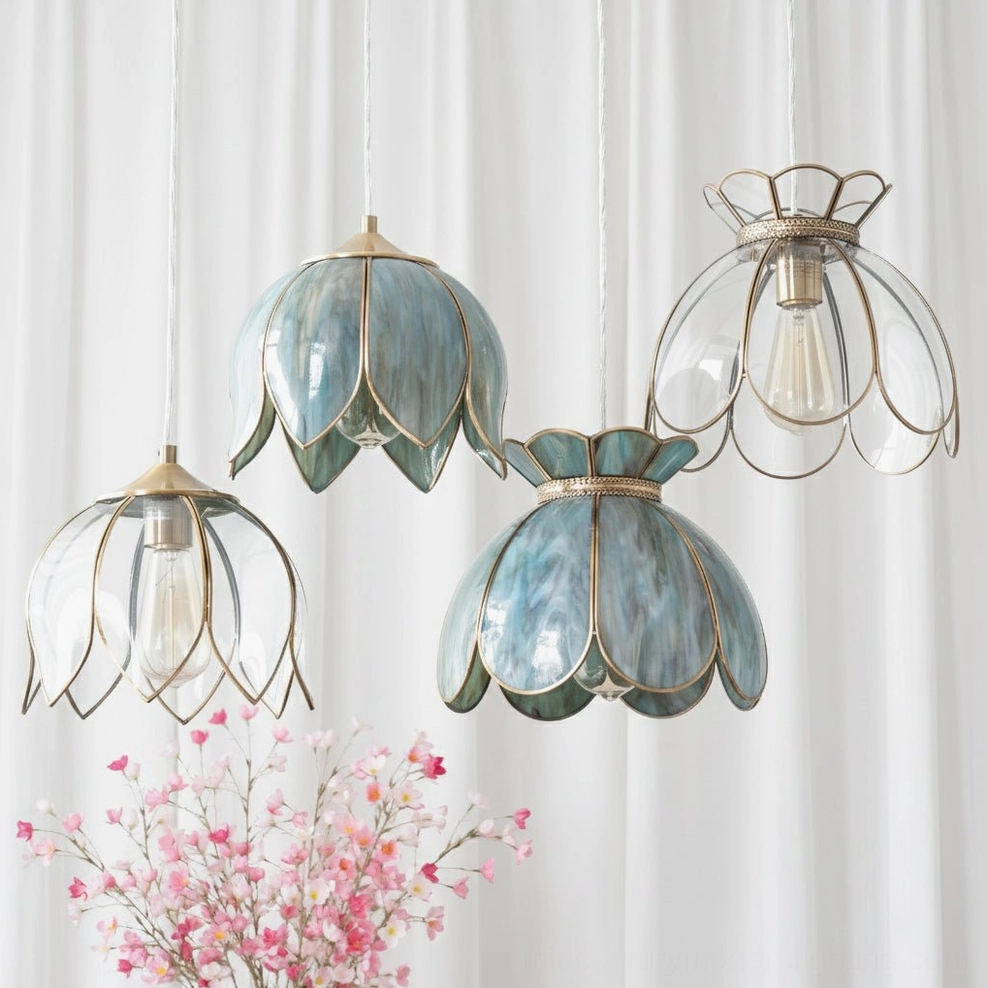Multiple Turrella petal pendant lights in various glass finishes hanging in studio with sheer curtains
