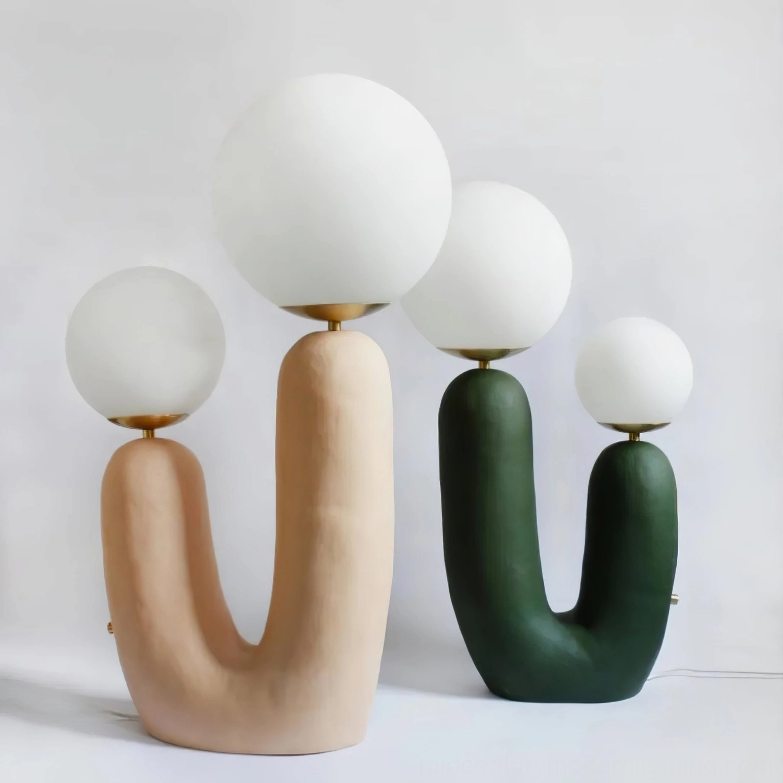 Two Oo ceramic table lamps side by side with complementary color bases