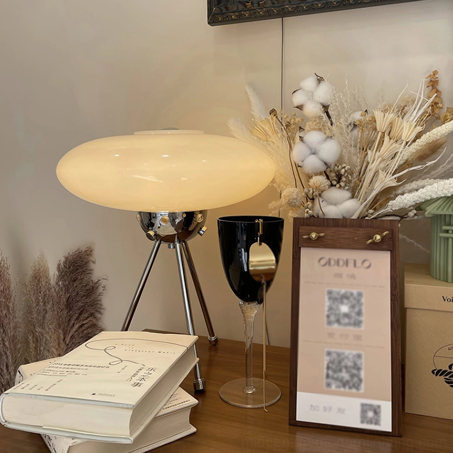 UFO glass table lamp detail shot showing frosted dome and polished chrome tripod craftsmanship