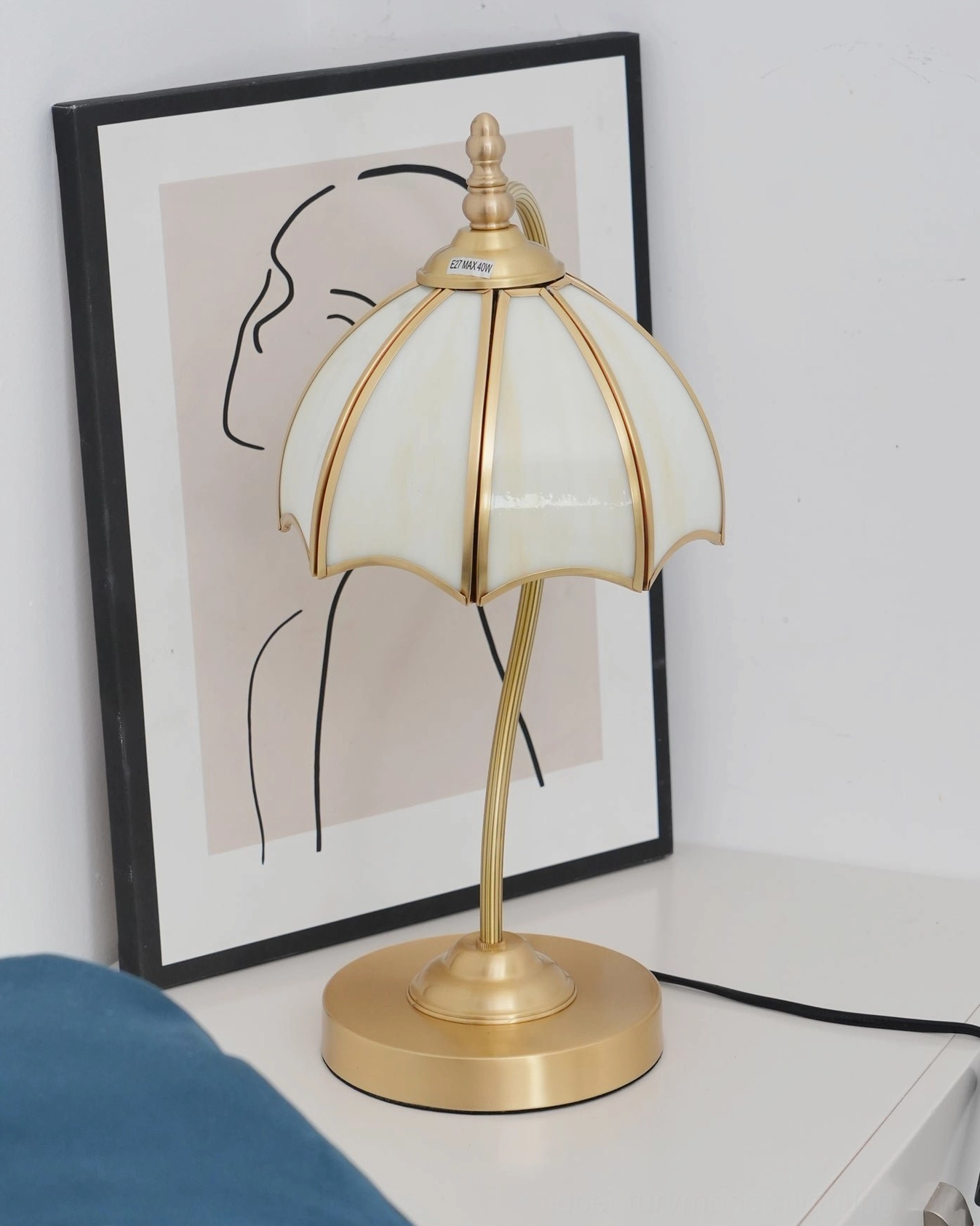 Umbrella table lamp adding artistic statement to contemporary bedroom interior design