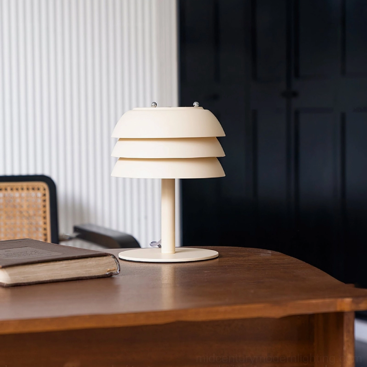 Valencia cream table lamp front view on dark wooden surface, clean mid-century modern minimalist aesthetic