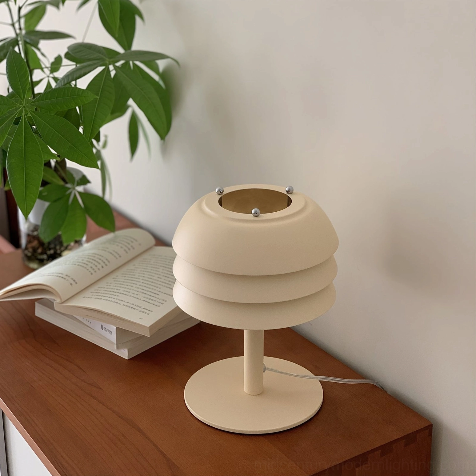 Valencia tiered table lamp detail view showing cylindrical metal construction and matte beige finish quality