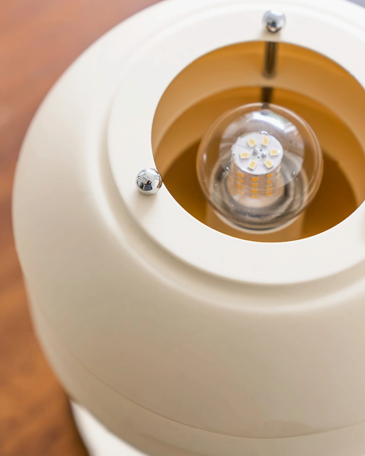 Valencia table lamp internal LED bulb socket mechanism, close-up view of metal screws and bulb mounting