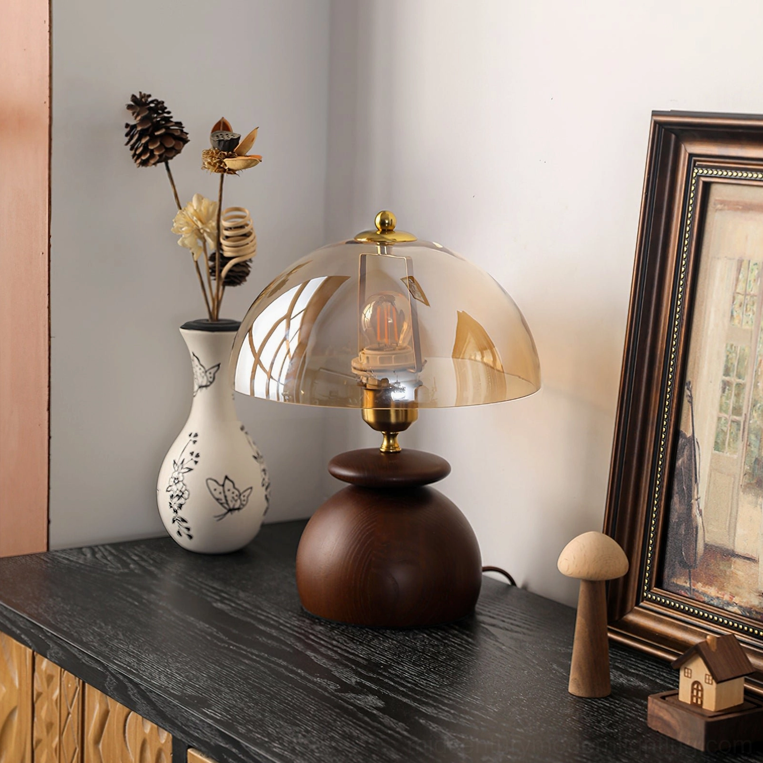 Valeska lamp pair styling on console table as sculptural bookends with warm ambient light