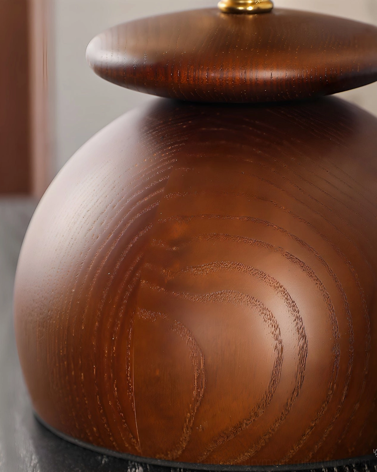 Valeska solid walnut wood base detail showing hand-turned stacked pebble form and grain texture