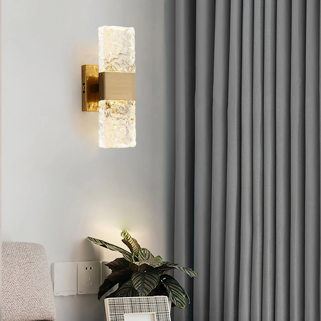 Vega double-ended wall lamp close-up on grey background, showcasing ice-like glass texture and finish
