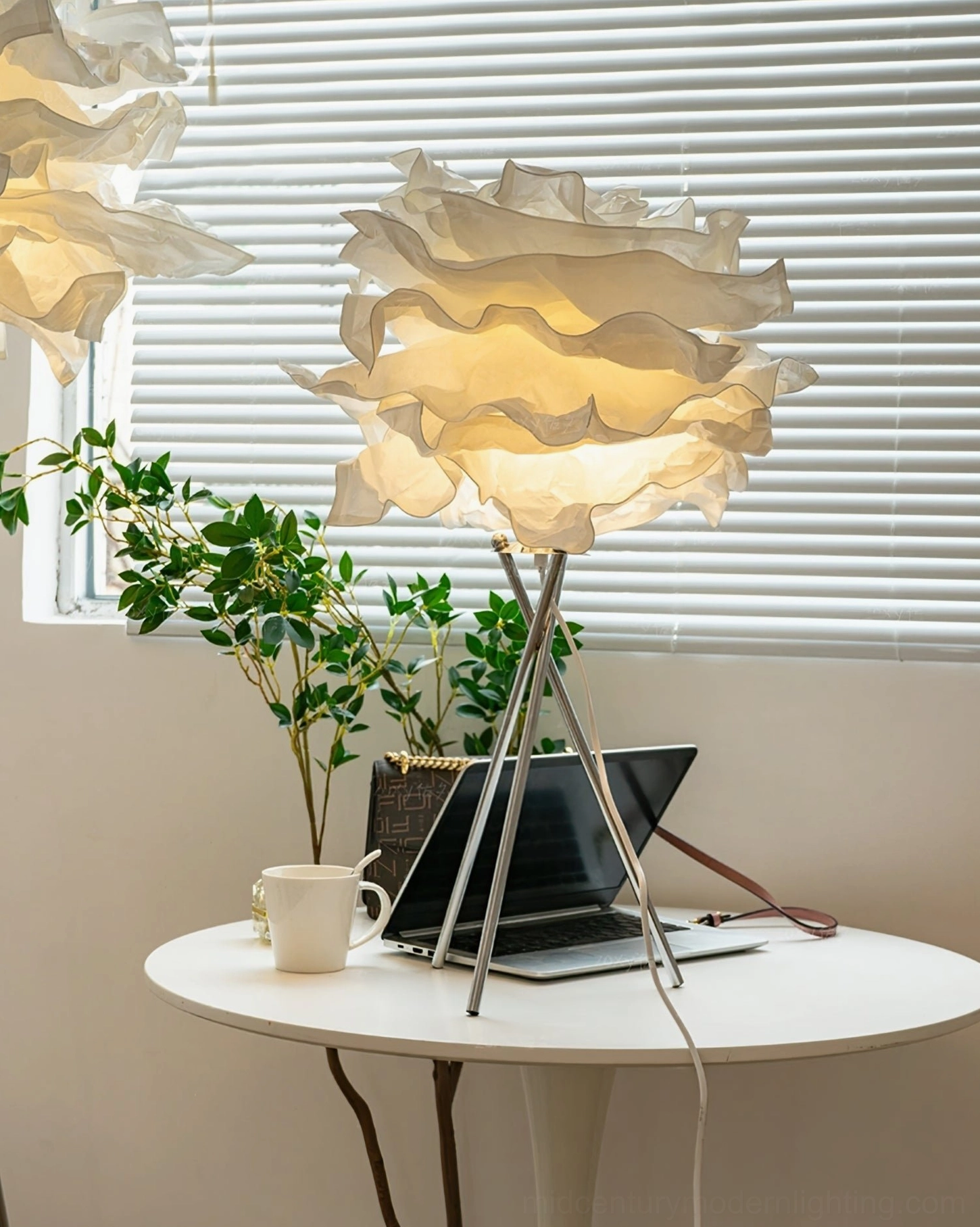 Veli artisanal mulberry paper table lamp with ruffled organic silhouette demonstrating mid-century modern lighting design aesthetic