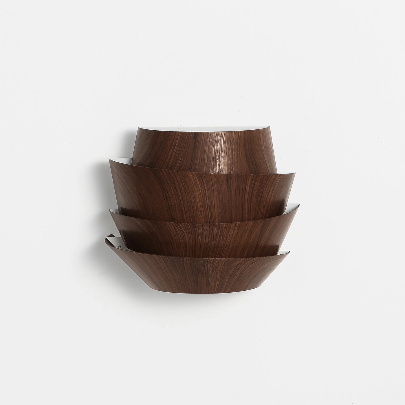 Veneer tiered wood grain wall sconce architectural detail shot showcasing curved panel construction