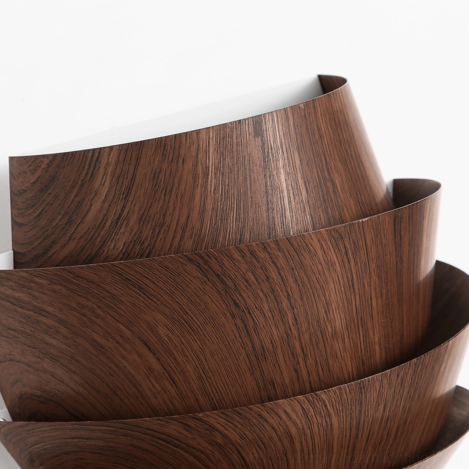 Veneer tiered panel wall lamp shadow play demonstration subtle light diffusion ambiance creation