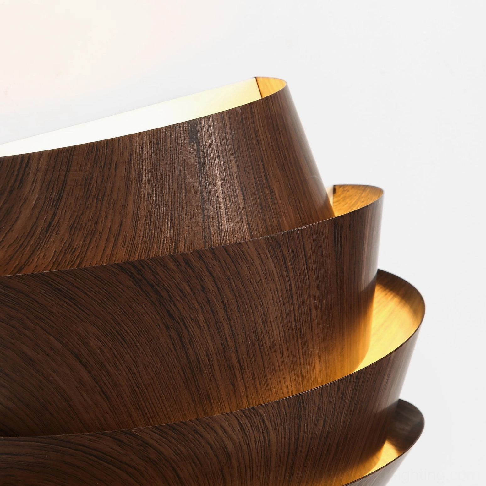 Veneer layered wall sconce warm walnut finish showcasing organic geometric sculptural aesthetic