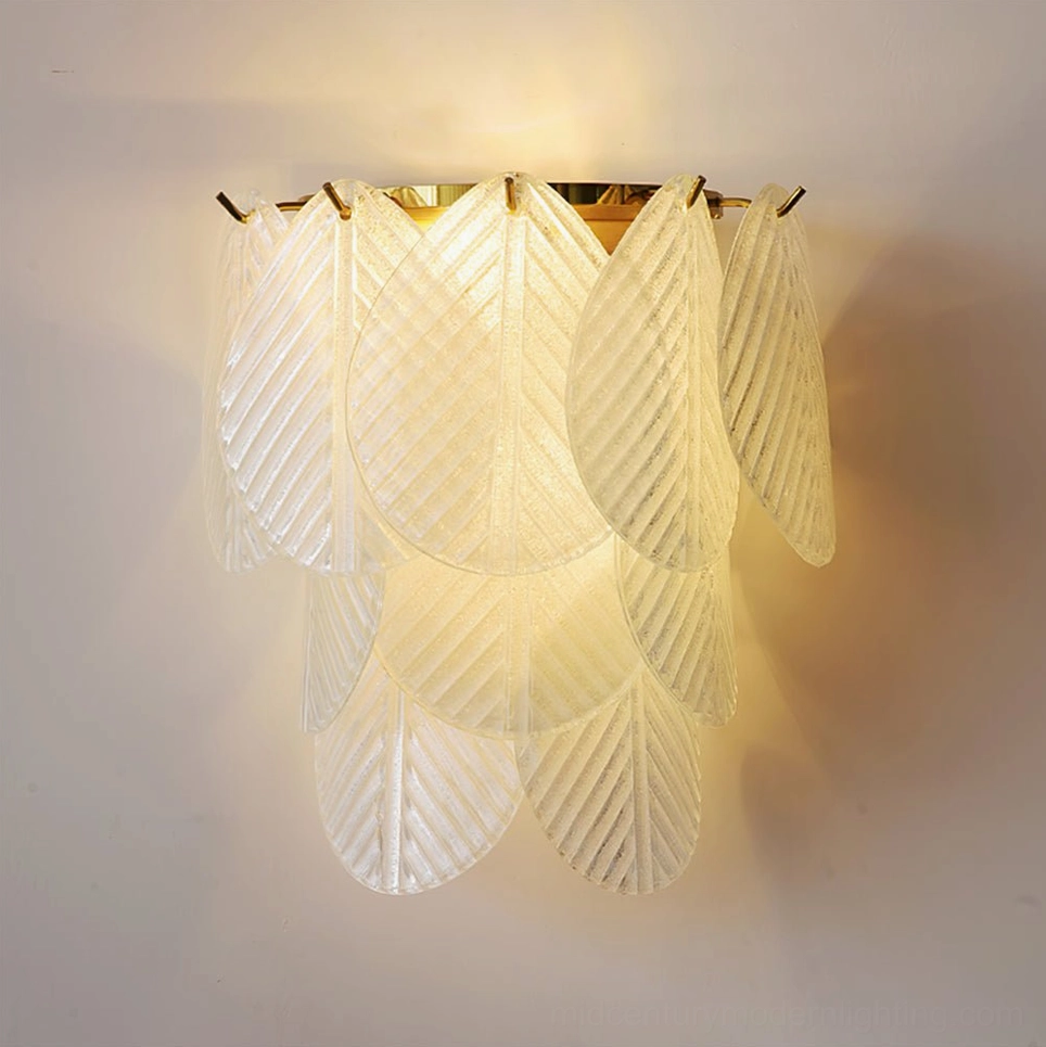 Verbier leaf wall lamp soft warm glowing multi-tiered glass silhouette low angle lighting