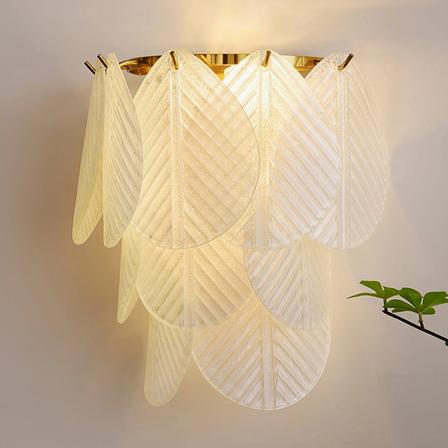 Verbier frosted glass leaf lamp illuminated bright warm amber glow close-up front view