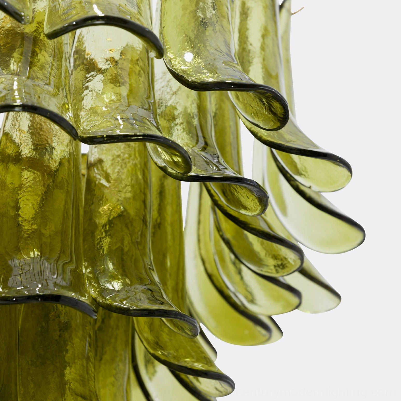 Close-up detail of handcrafted glass petal showing wavy textured surface and olive green coloration