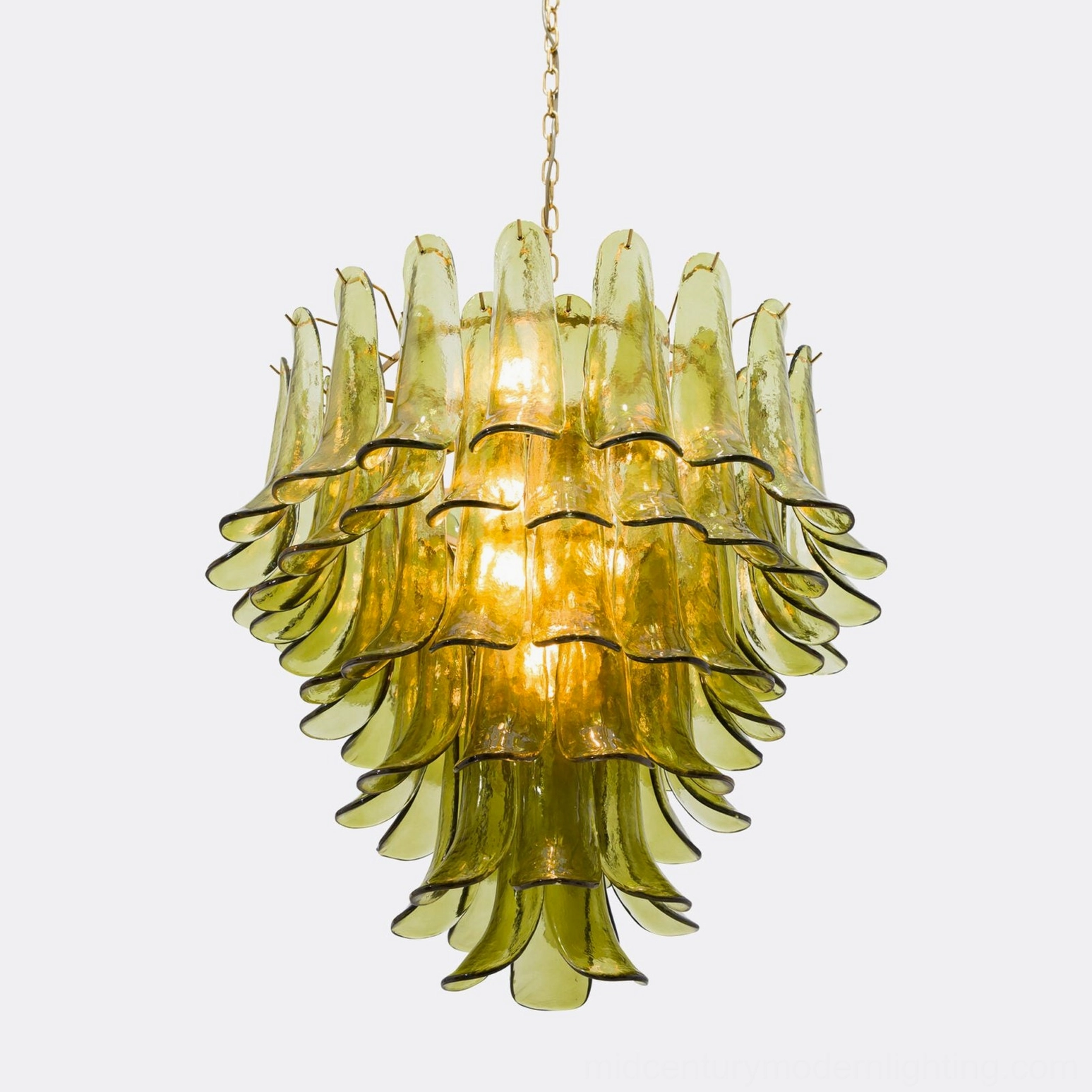 Verdant Petalo chandelier in lit condition displaying warm amber illumination through multi-tiered glass shade layers