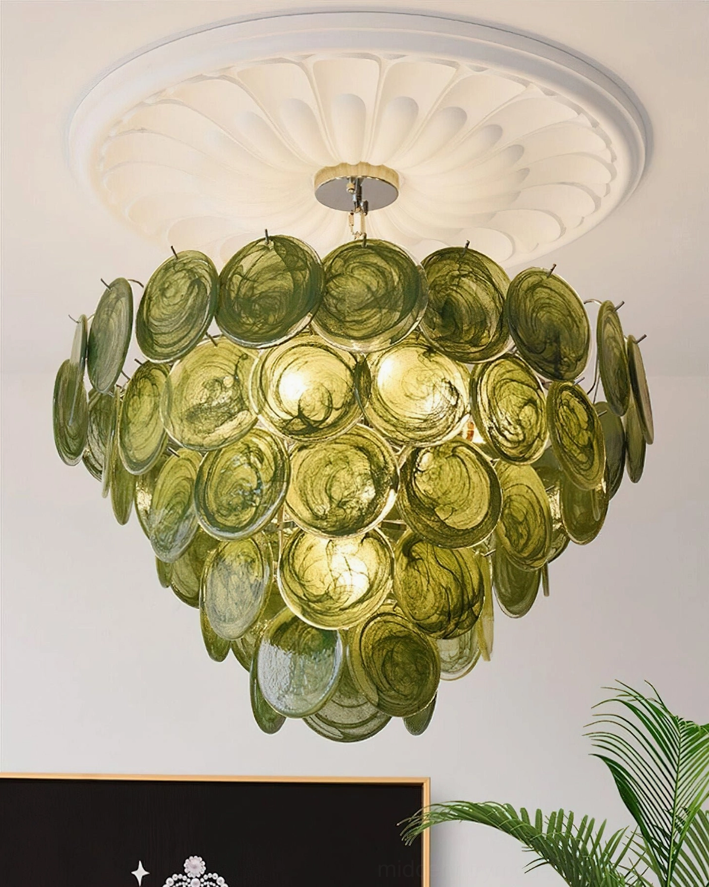 Verde Glass Disc Chandelier installed in modern dining room with overhead view and natural lighting