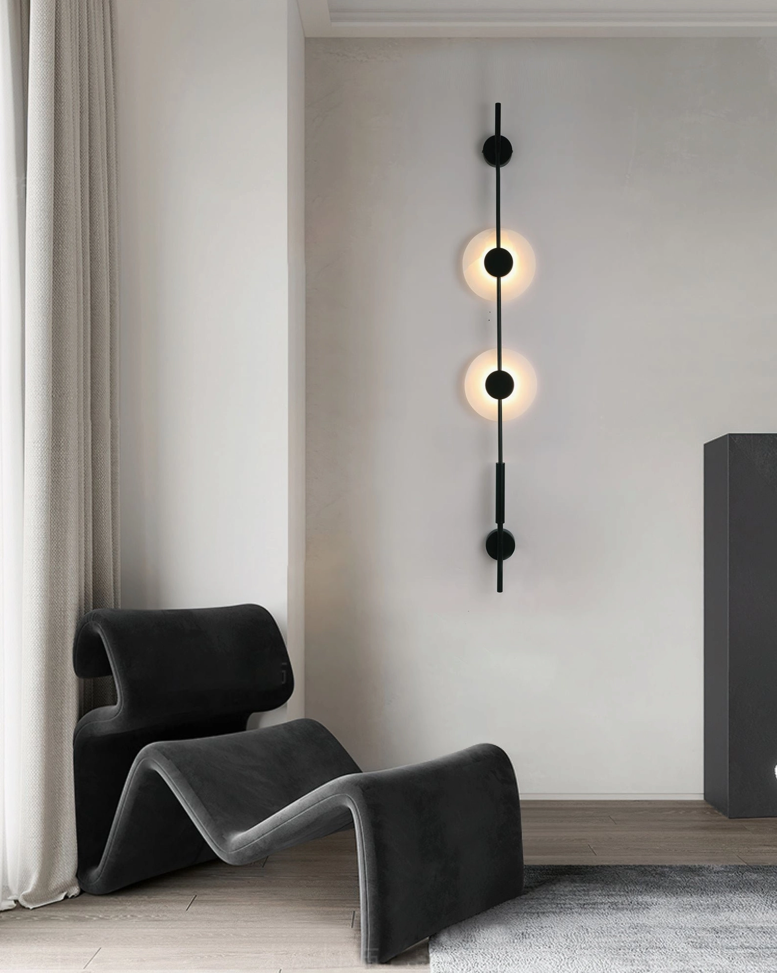 Sleek matte black vertical alabaster wall lamp with minimalist linear rod design and two frosted light shades in modern lounge corner
