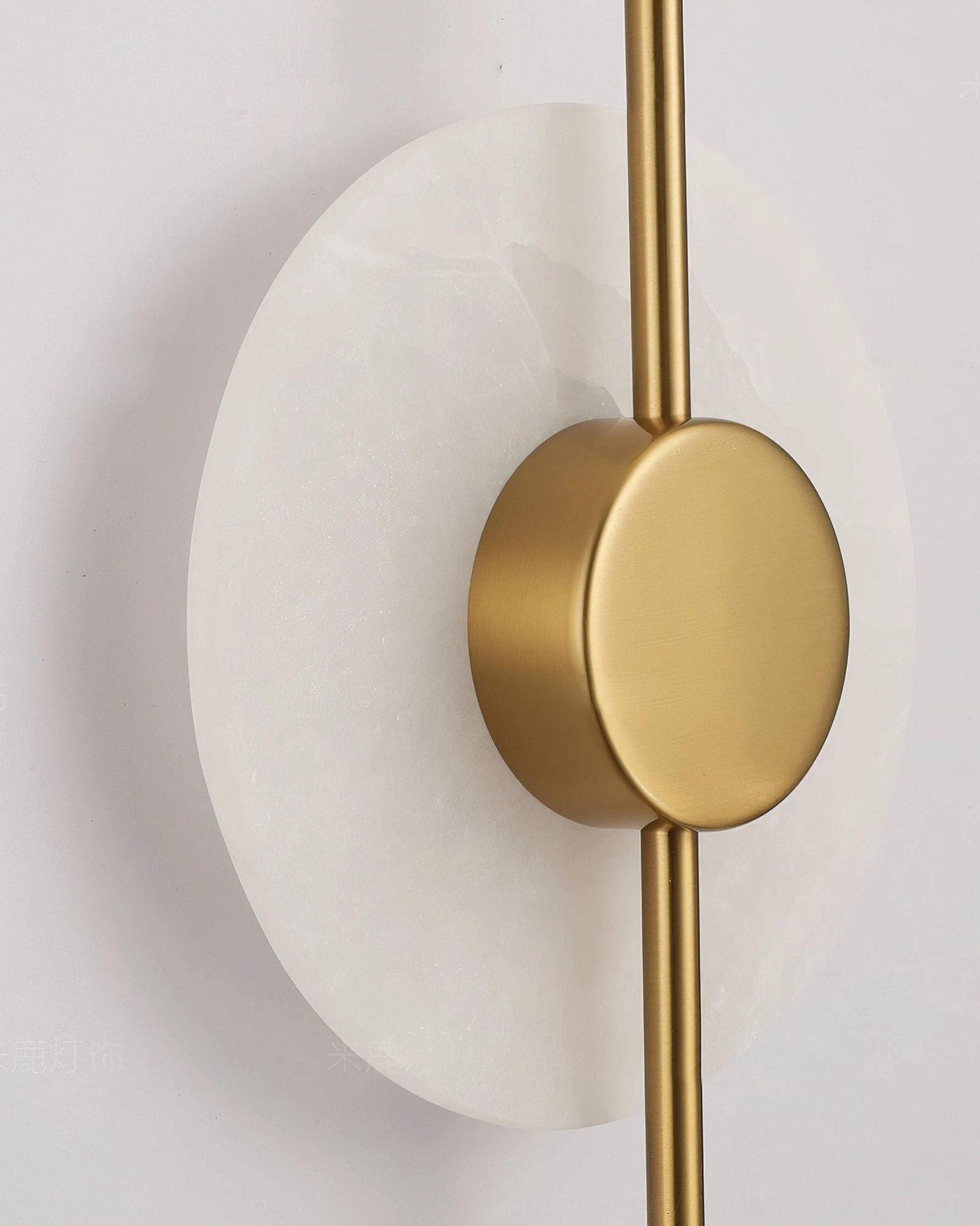 Vertical alabaster wall lamp three-light configuration in gallery-style contemporary space with sculptural lighting presence