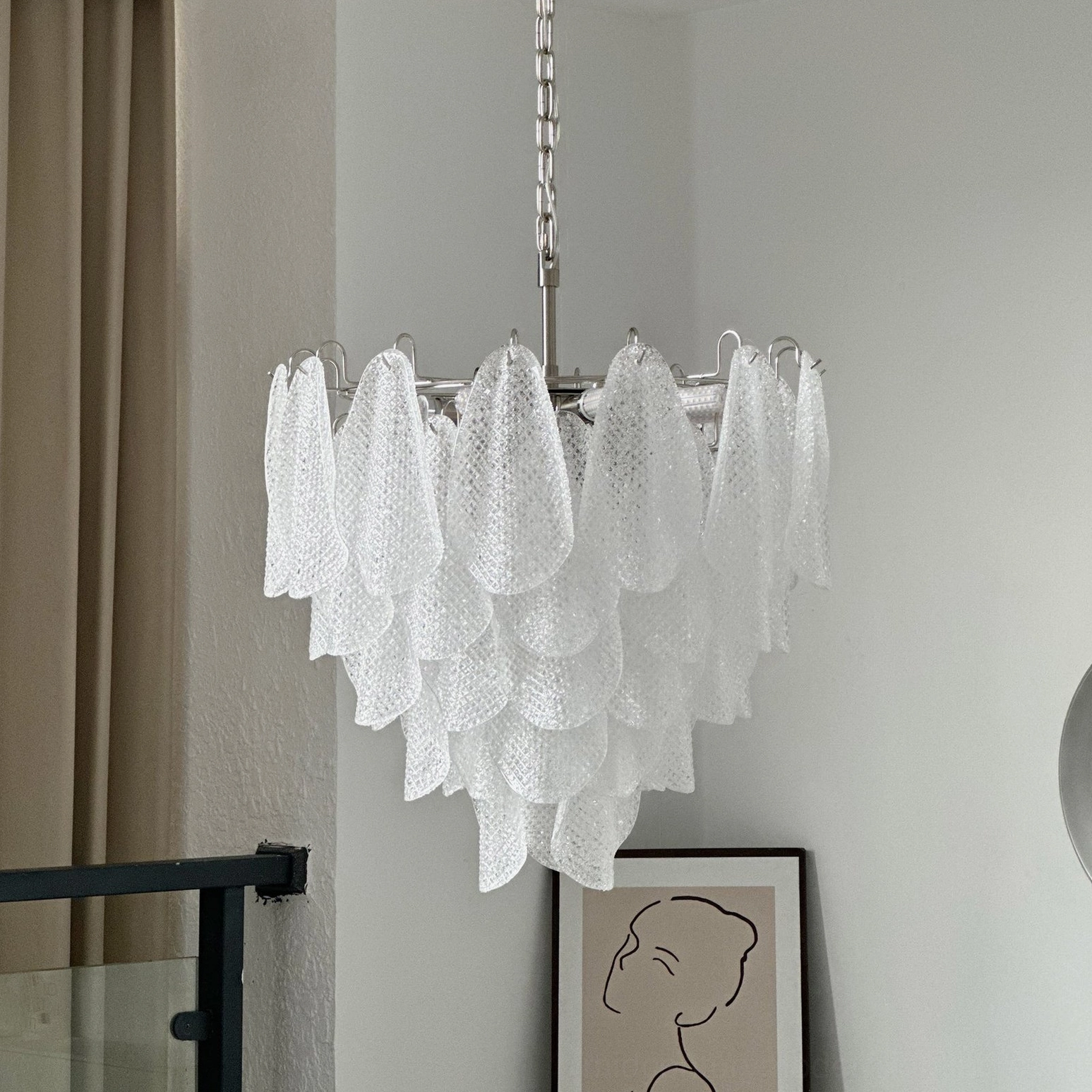 Mid-century modern murano-style ripple glass chandelier in designer interior showcase