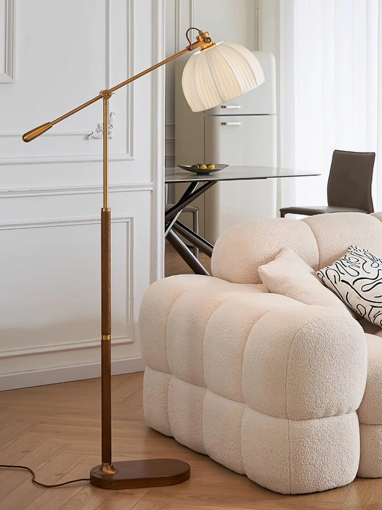 Vintage brass floor lamp with oval metal base and walnut wood finish in dining-living combined interior space