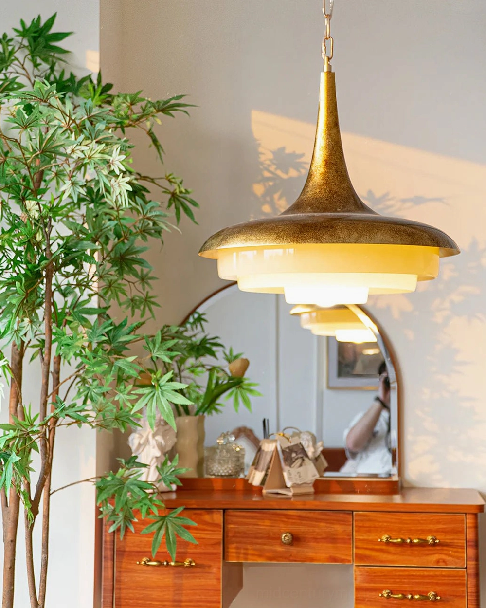 Tiered pendant lamp installed in vintage bedroom with warm ambient lighting over vanity