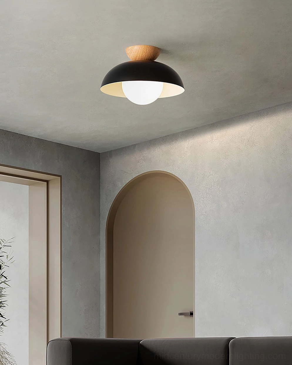 Black Volo ceiling fixture in contemporary living room - modern minimalist space with soft ambient lighting