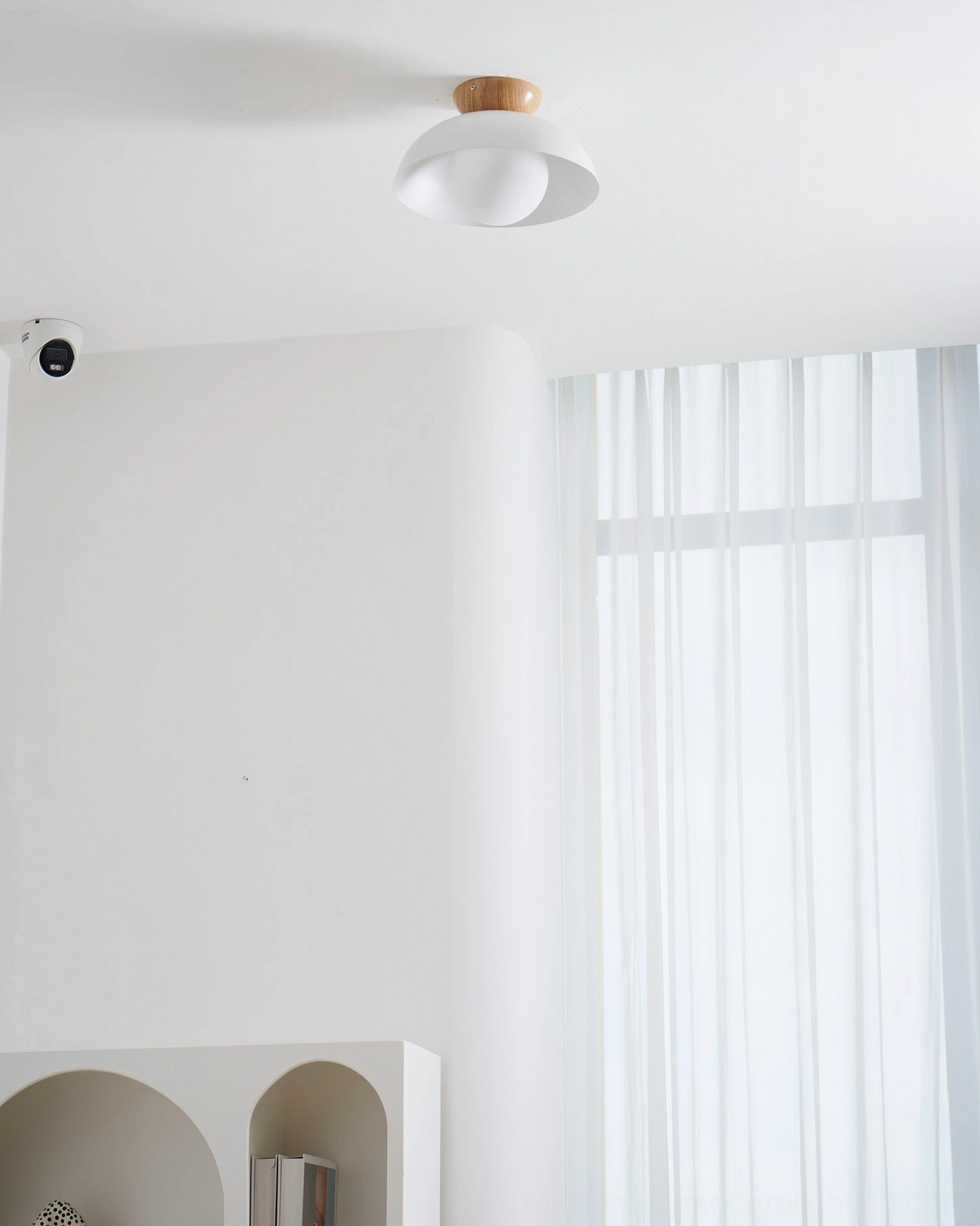 Volo ceiling fixture in cabin space - woodgrain finish, A-frame sloped ceiling, rustic modern