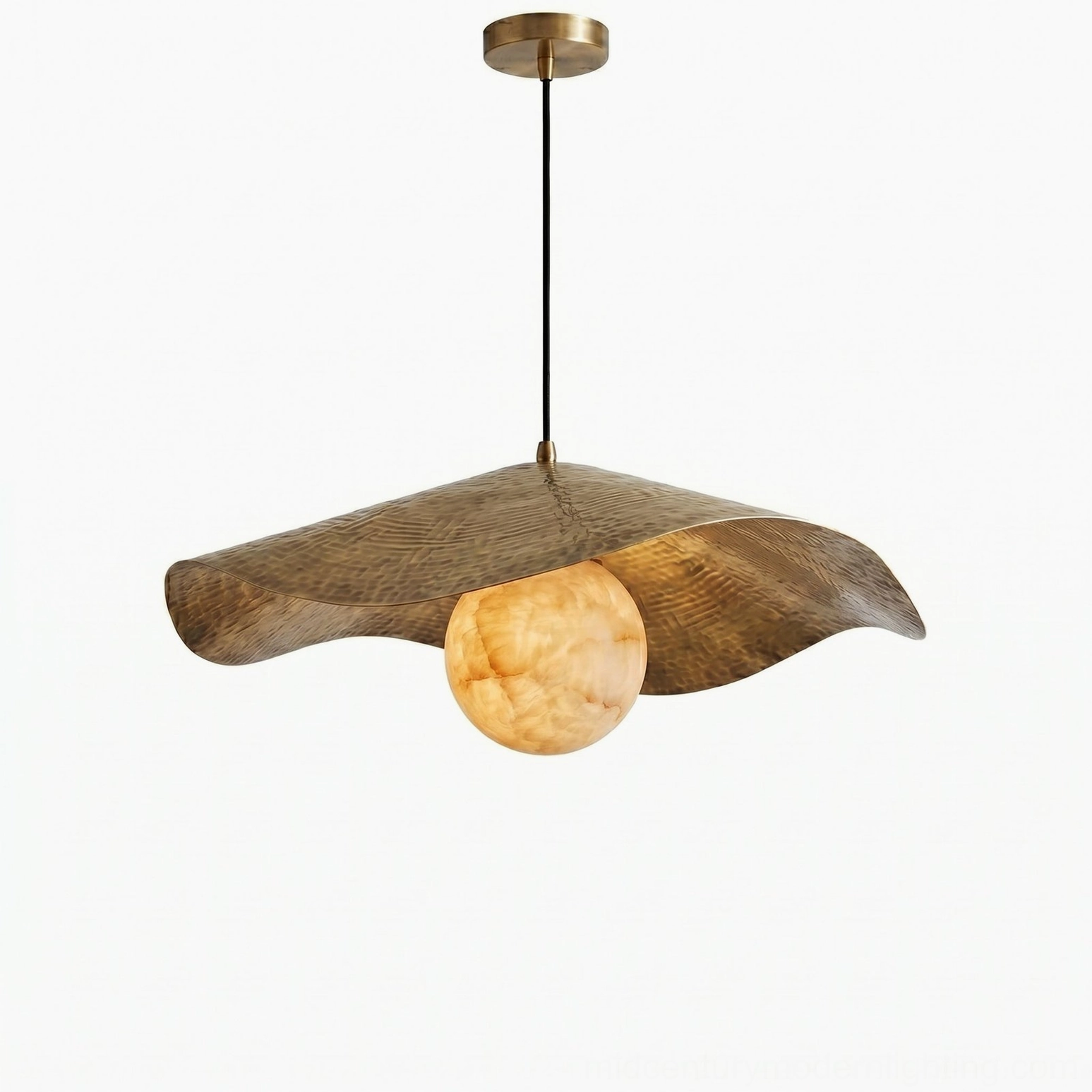 Artisanal alabaster and brass pendant light fixture highlighting wabi-sabi design philosophy and natural material beauty
