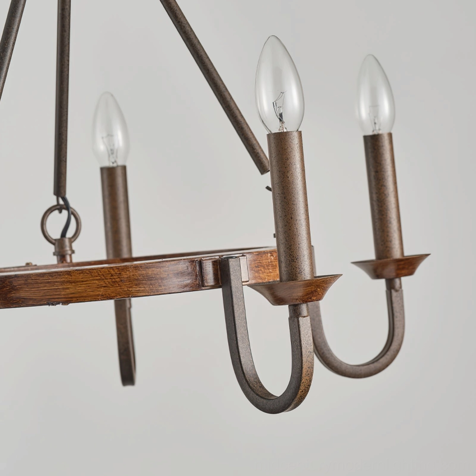 Wagon wheel chandelier arm detail weathered wood ring brushed metal close-up