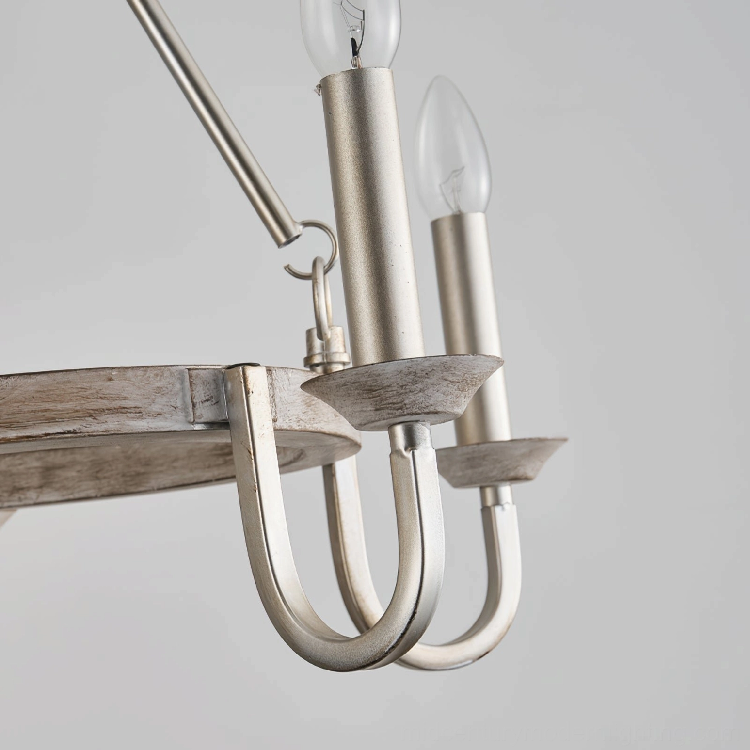 Chrome finish wagon wheel chandelier arm detail brushed silver metal close-up