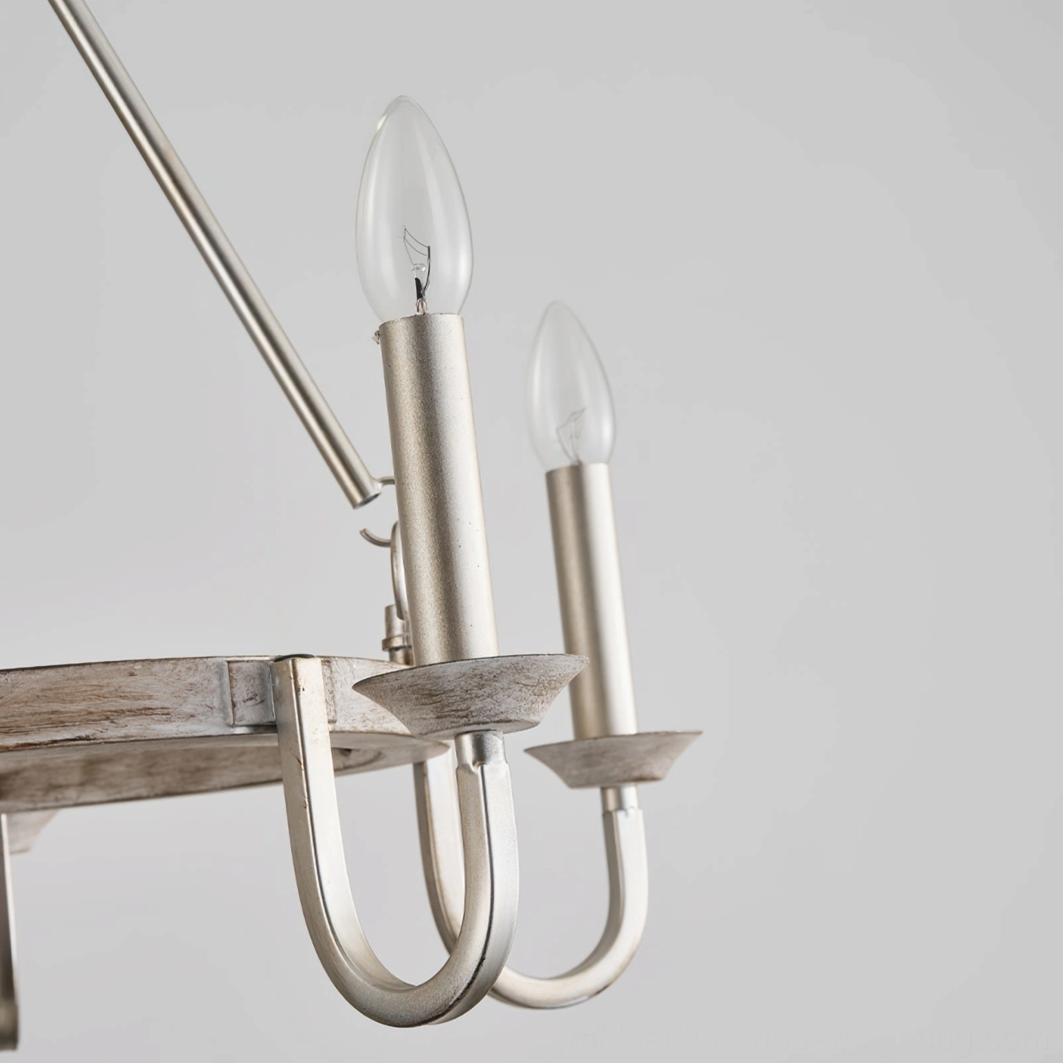 Silver tone wagon wheel chandelier arm candle bulb holder front close-up view