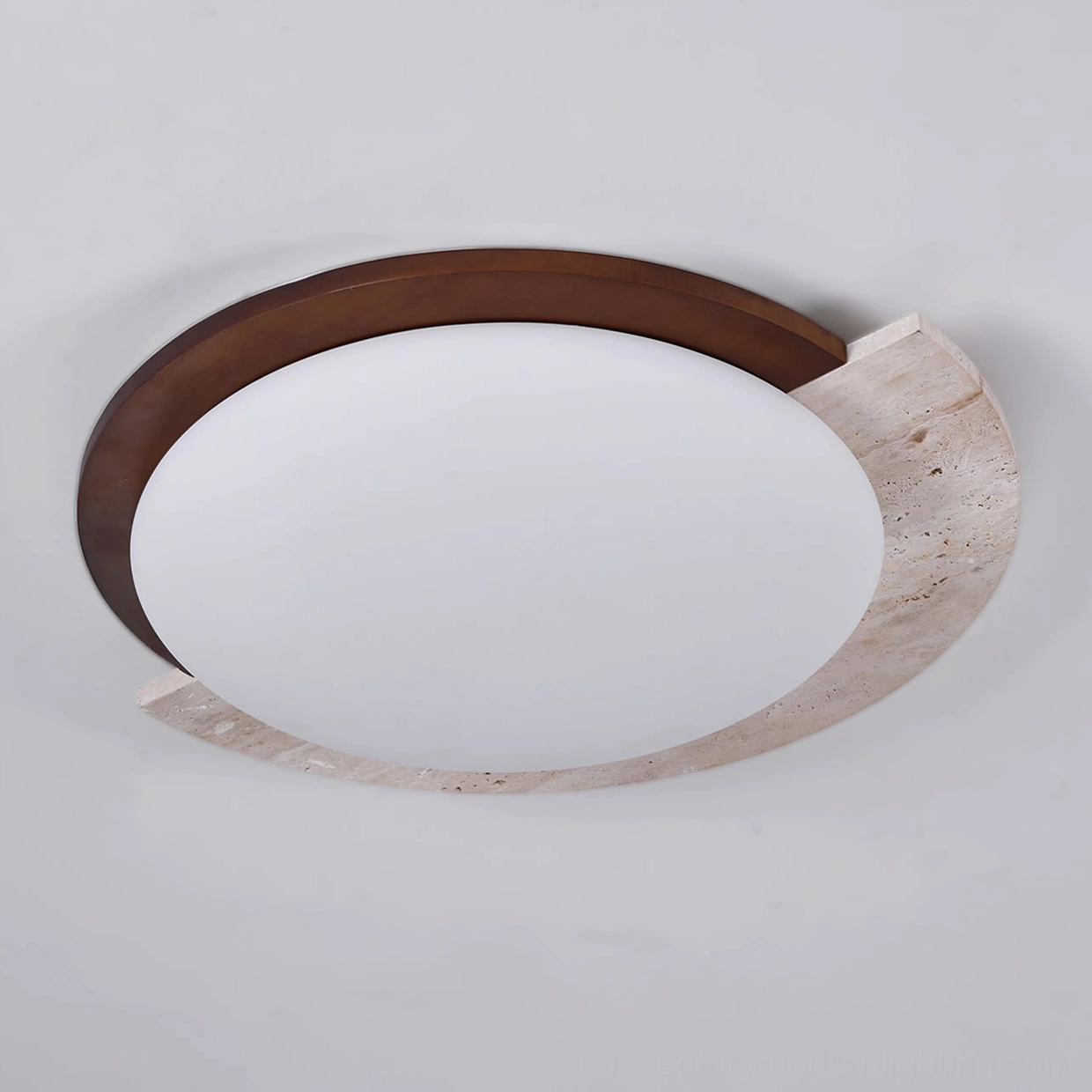 Detail view of walnut wood trim and yellow travertine stone on asymmetrical flush mount ceiling lamp