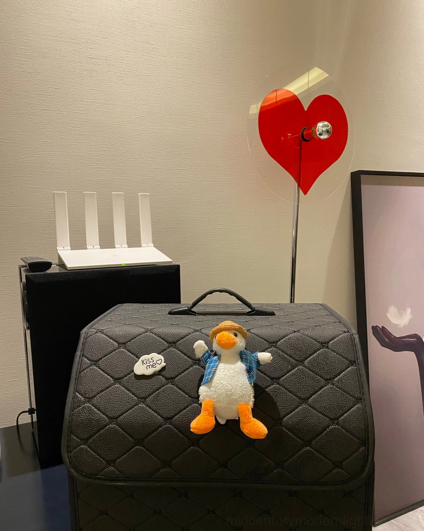 Red heart floor lamp creating warm shadow projection perfect for contemporary home decoration