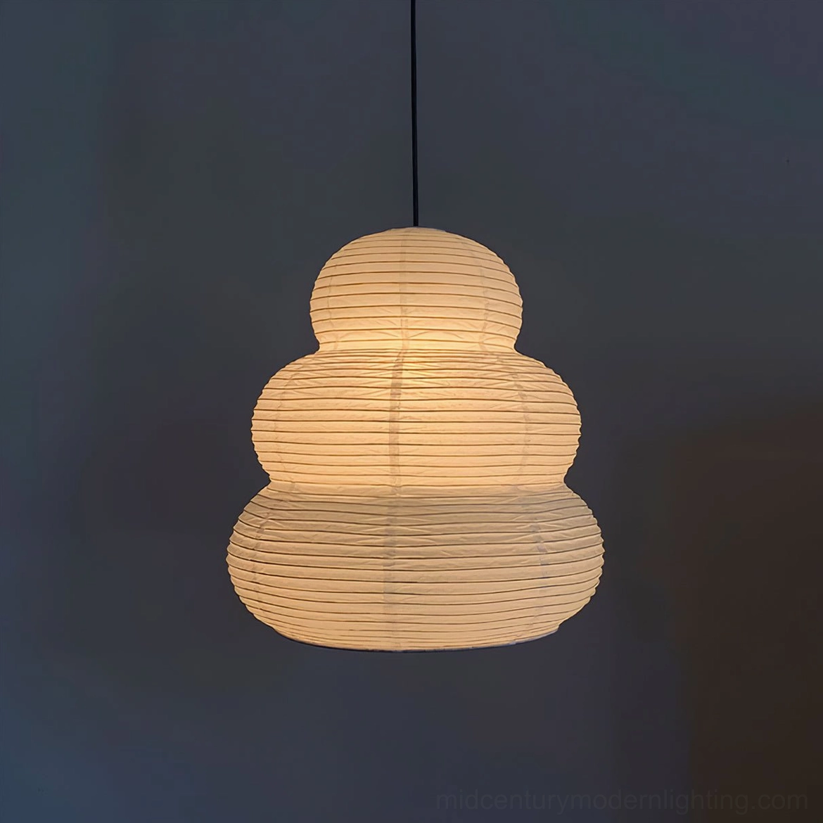 Washi 24N handcrafted mulberry paper pendant close-up showing ribbed texture and warm beige diffused light