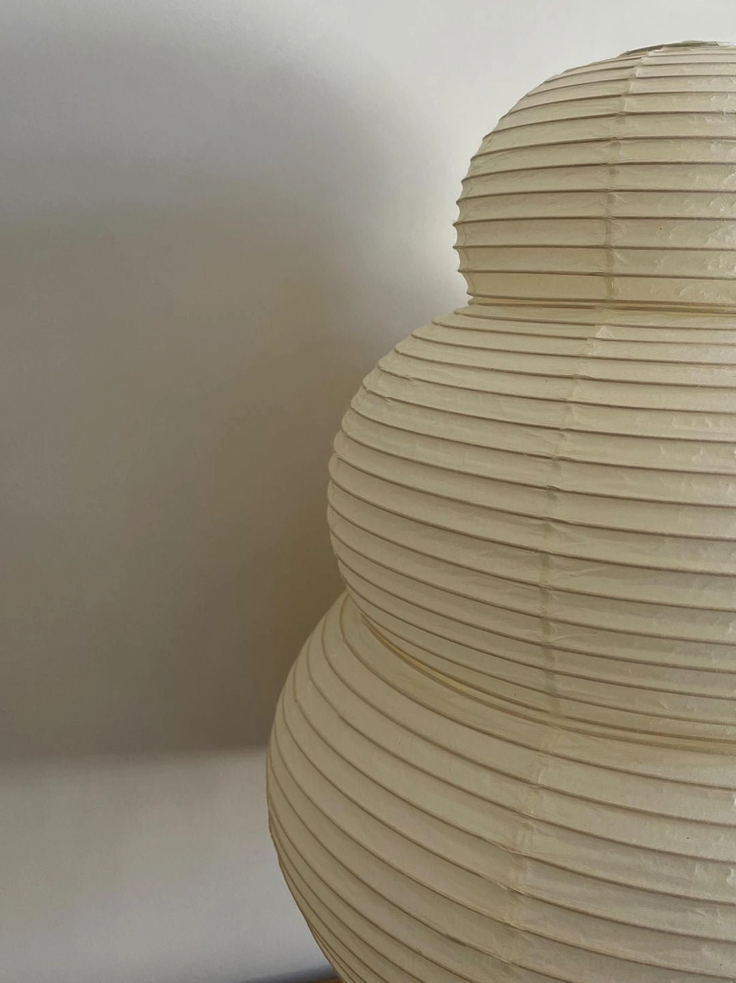 Washi 24N mulberry paper pendant showing sculptural silhouette and ambient light diffusion capability