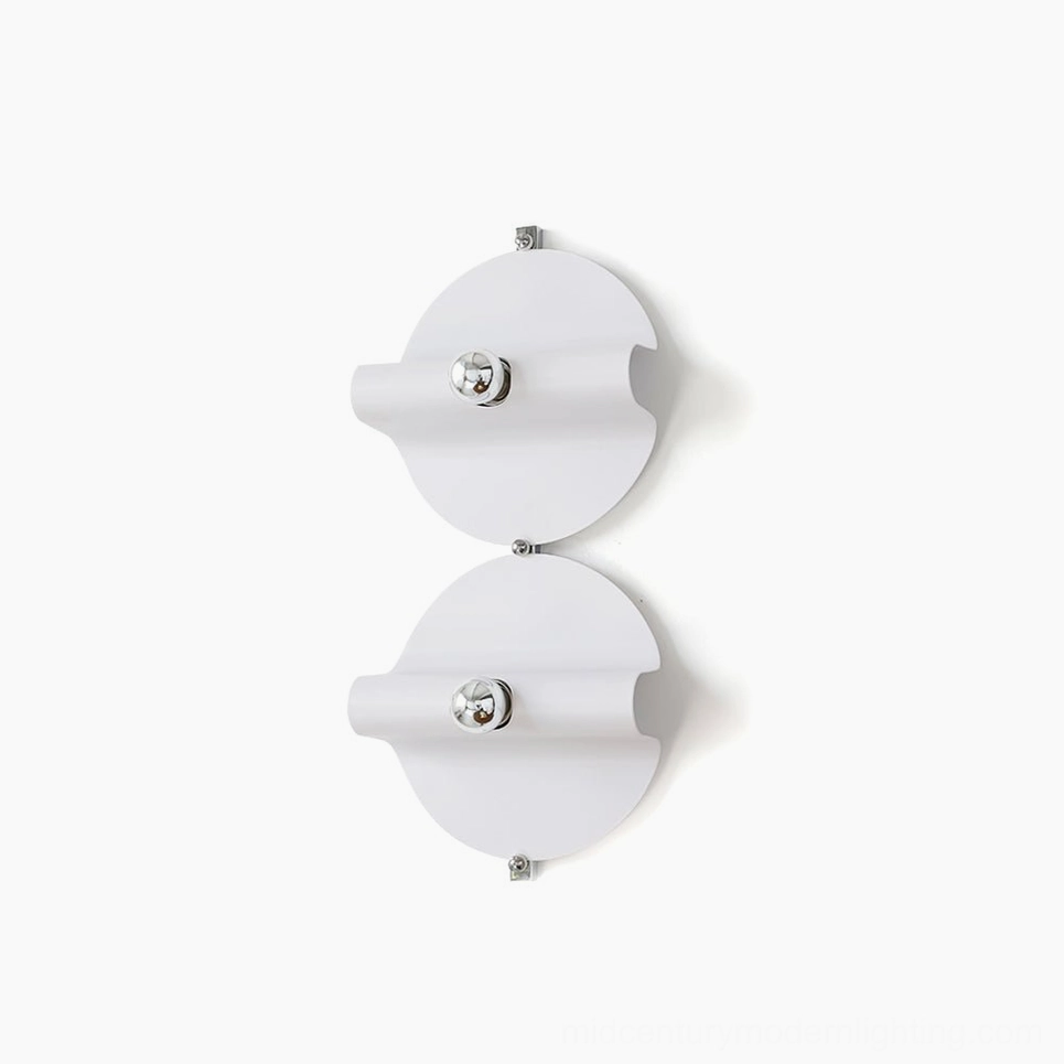 Dual modern minimalist white wall sconces with chrome hardware mounted on white wall, studio shot