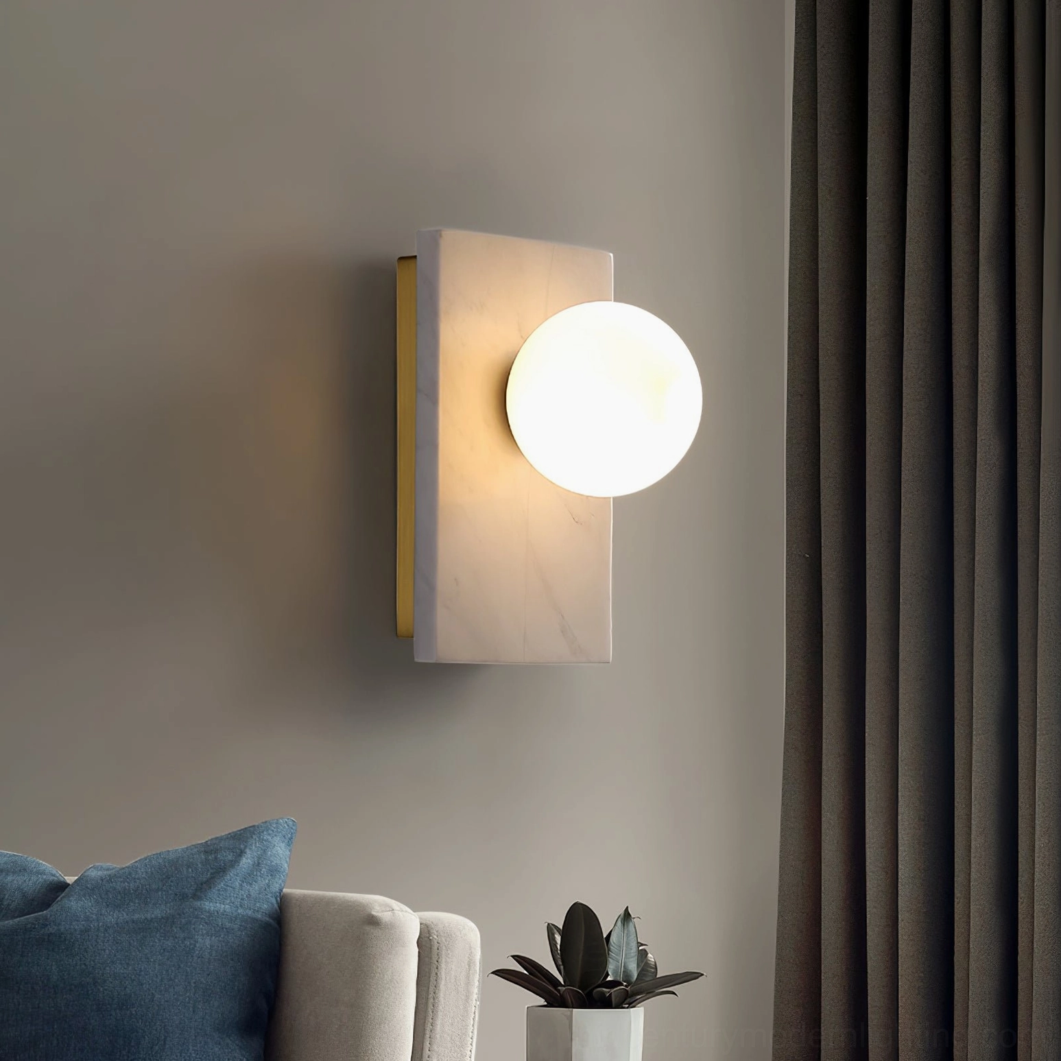 White marble variant of Lan wall sconce in contemporary living room setting showing versatile neutral aesthetic