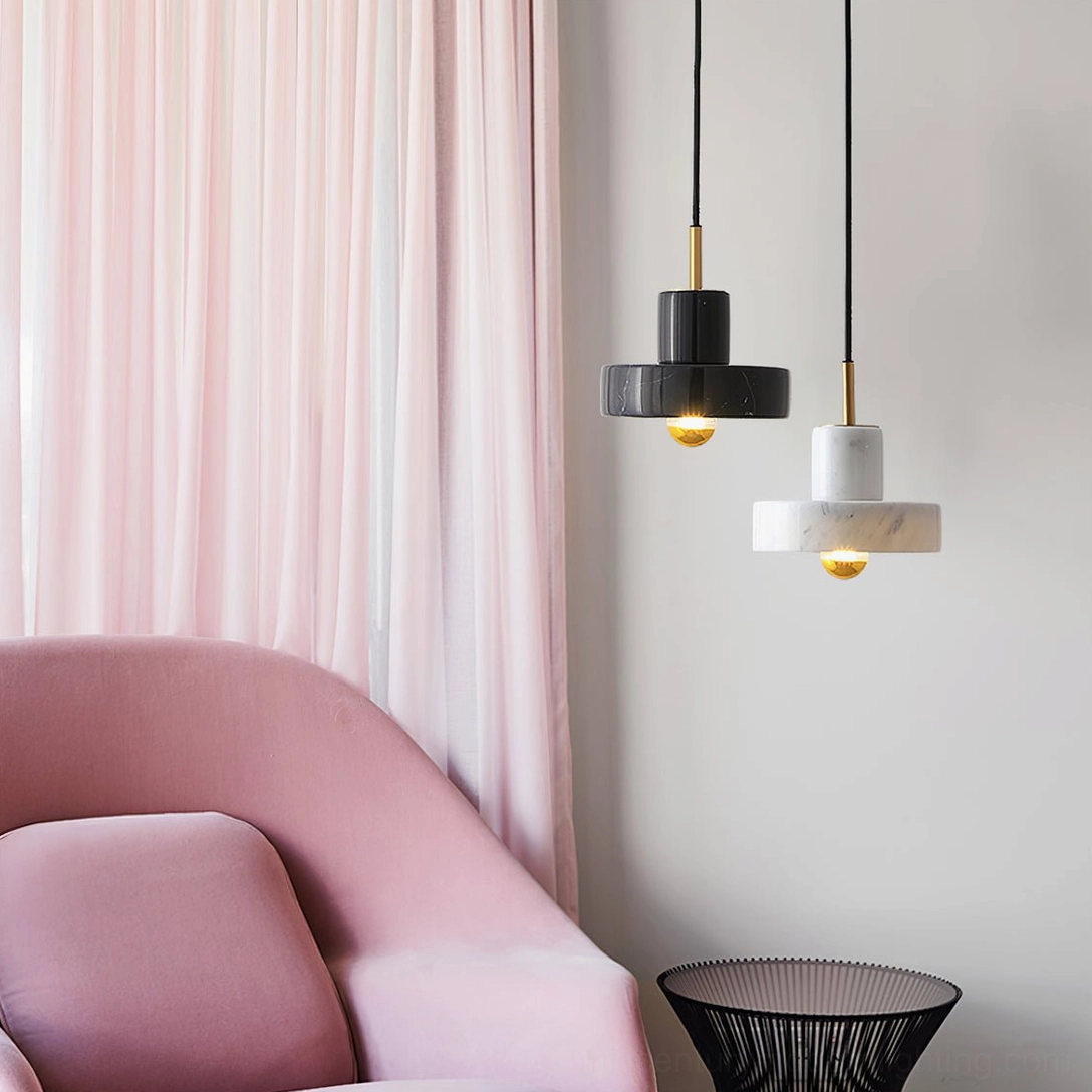 White marble pendant light in minimalist dining setting with natural light and clean aesthetic