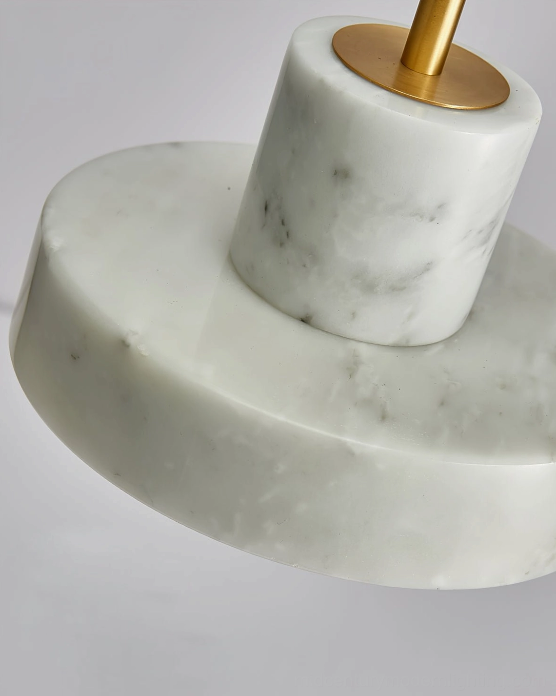 White marble pendant lamp side angle view displaying translucent stone and brass accents