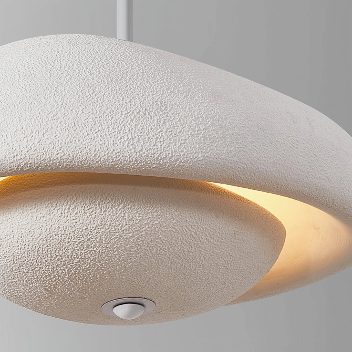 Off-white resin pendant lamp close-up front view showing built-in warm ambient light and fixture base