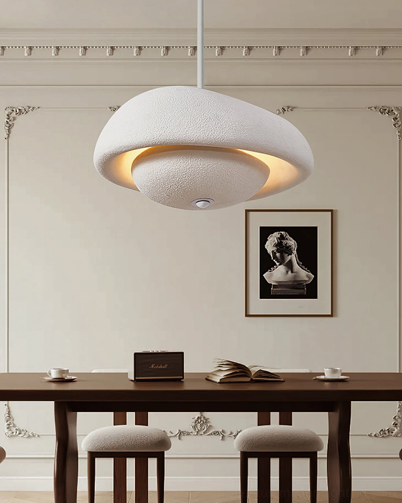 Off-white cloud-textured resin pendant lamp in neoclassical dining room with neutral wabi-sabi aesthetic