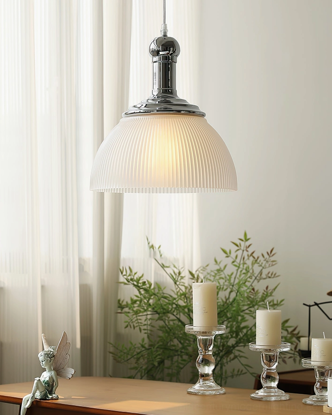 White ribbed glass pendant light with soft diffused warm lighting in elegant dining room decor