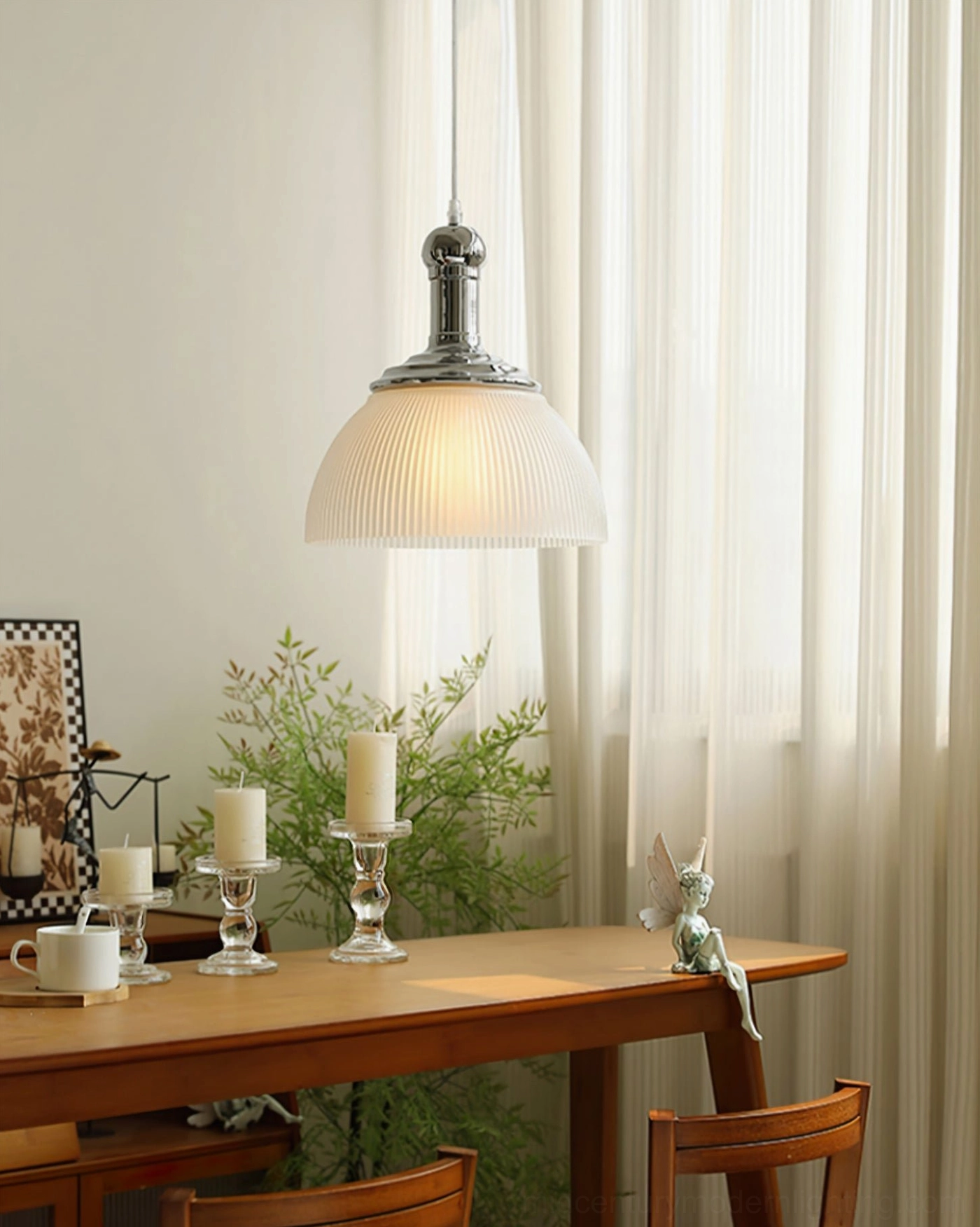Translucent white ribbed pendant lamp glowing warmly in cozy dining room, three-quarter frontal view