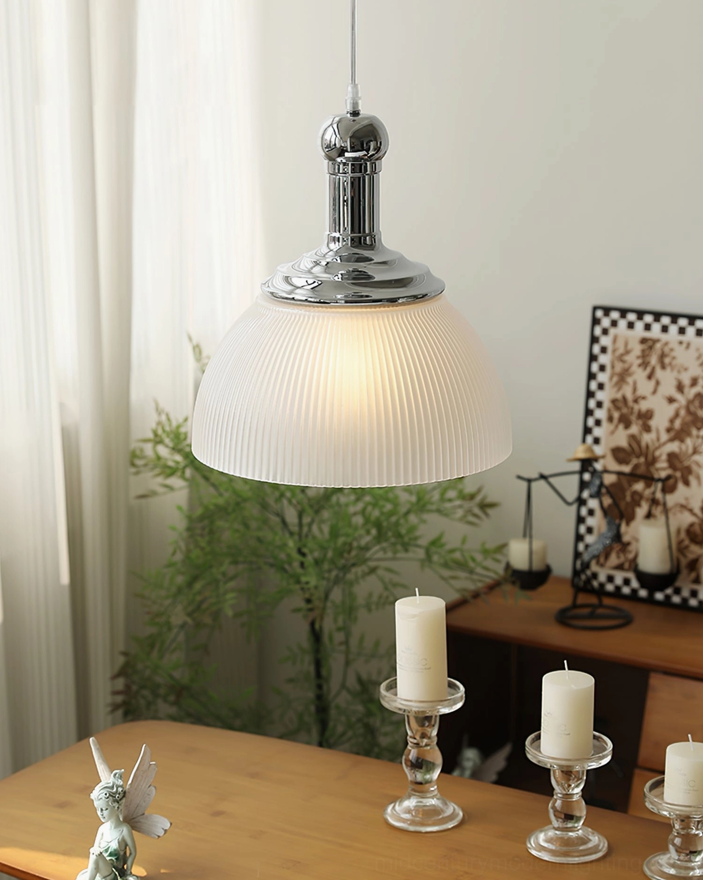 White ribbed glass pendant light side angled view in cozy dining room with vintage industrial warm glow