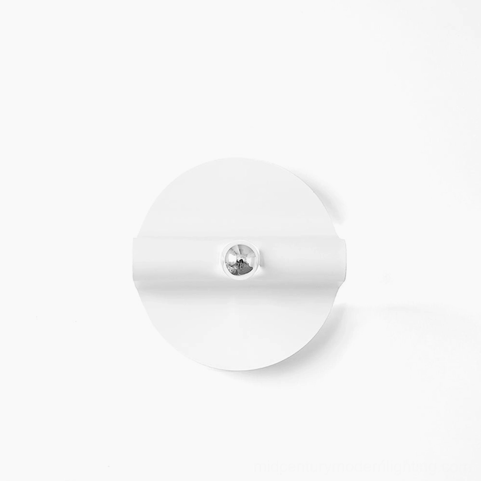 Minimalist white circular wall sconce base flat lay overhead view on white background