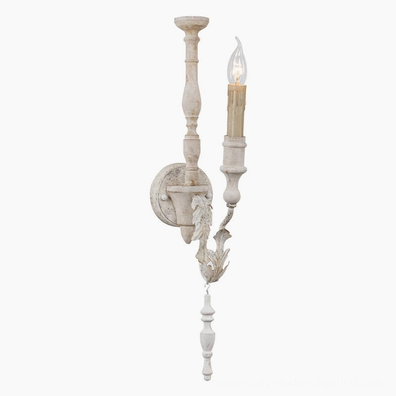 Off-white weathered candlestick wall sconce with delicate metal accents and aged finish